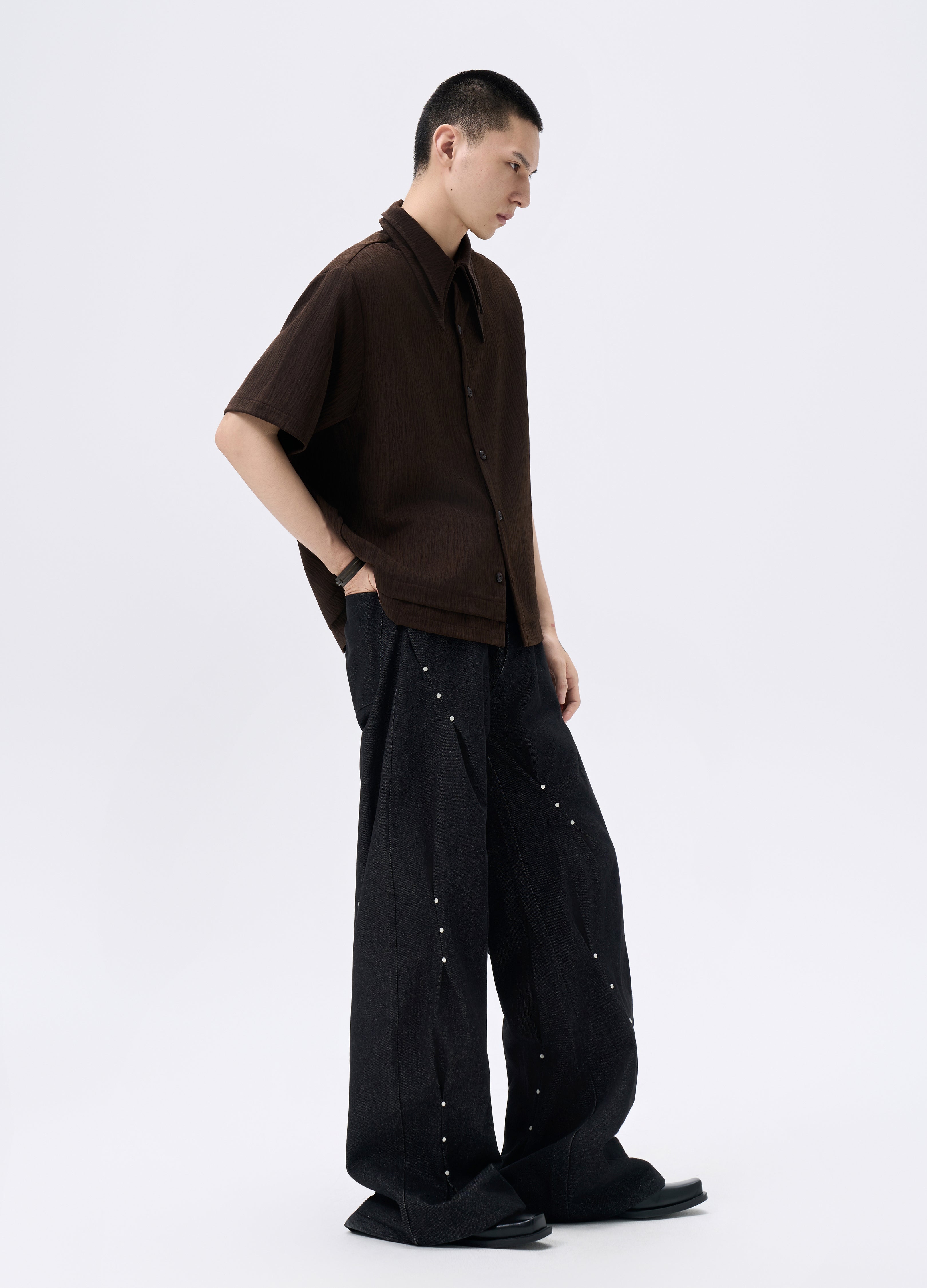 25FW STUDDED TWISTED DENIM TROUSERS