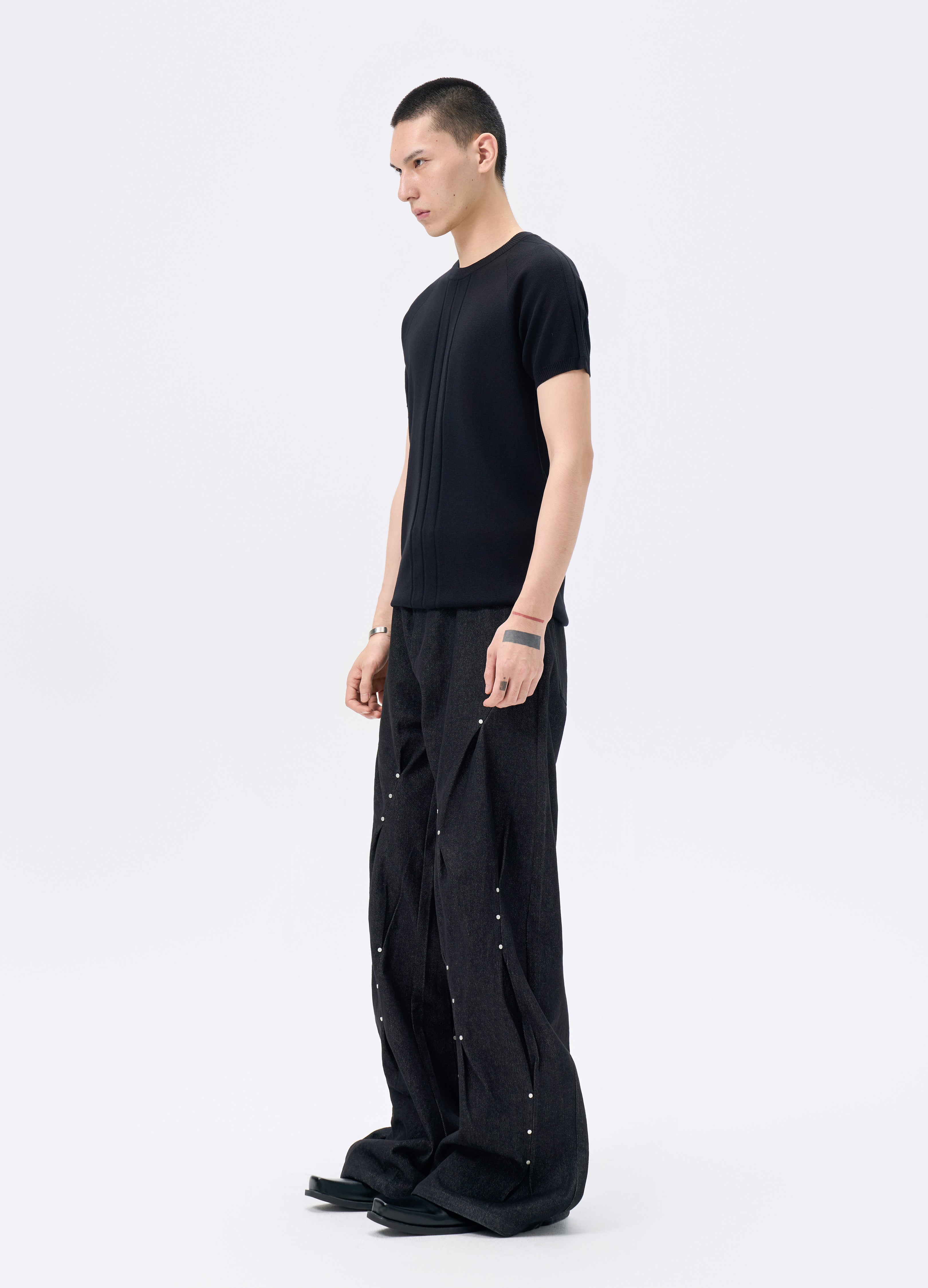 25FW STUDDED TWISTED DENIM TROUSERS