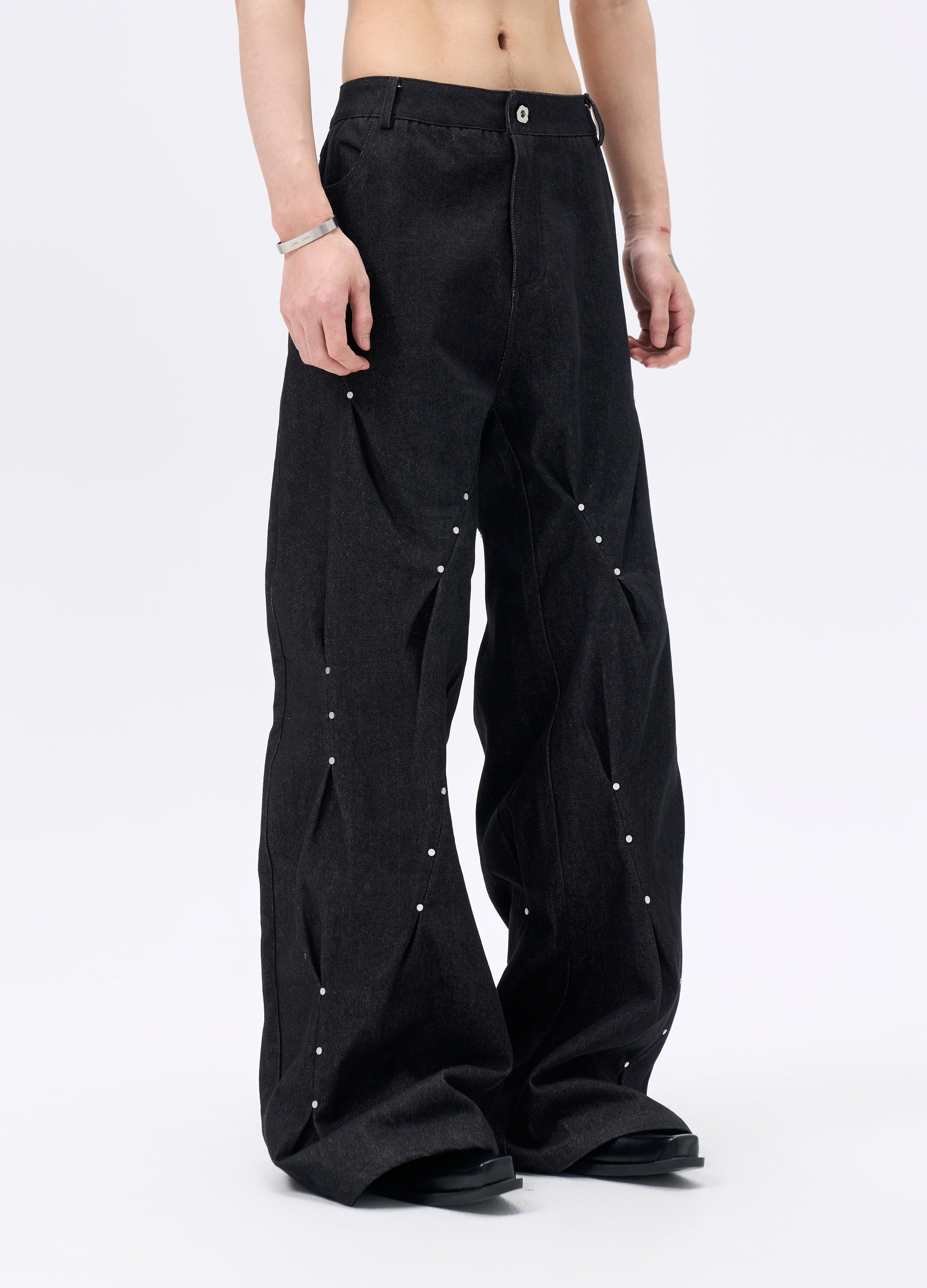 25FW STUDDED TWISTED DENIM TROUSERS