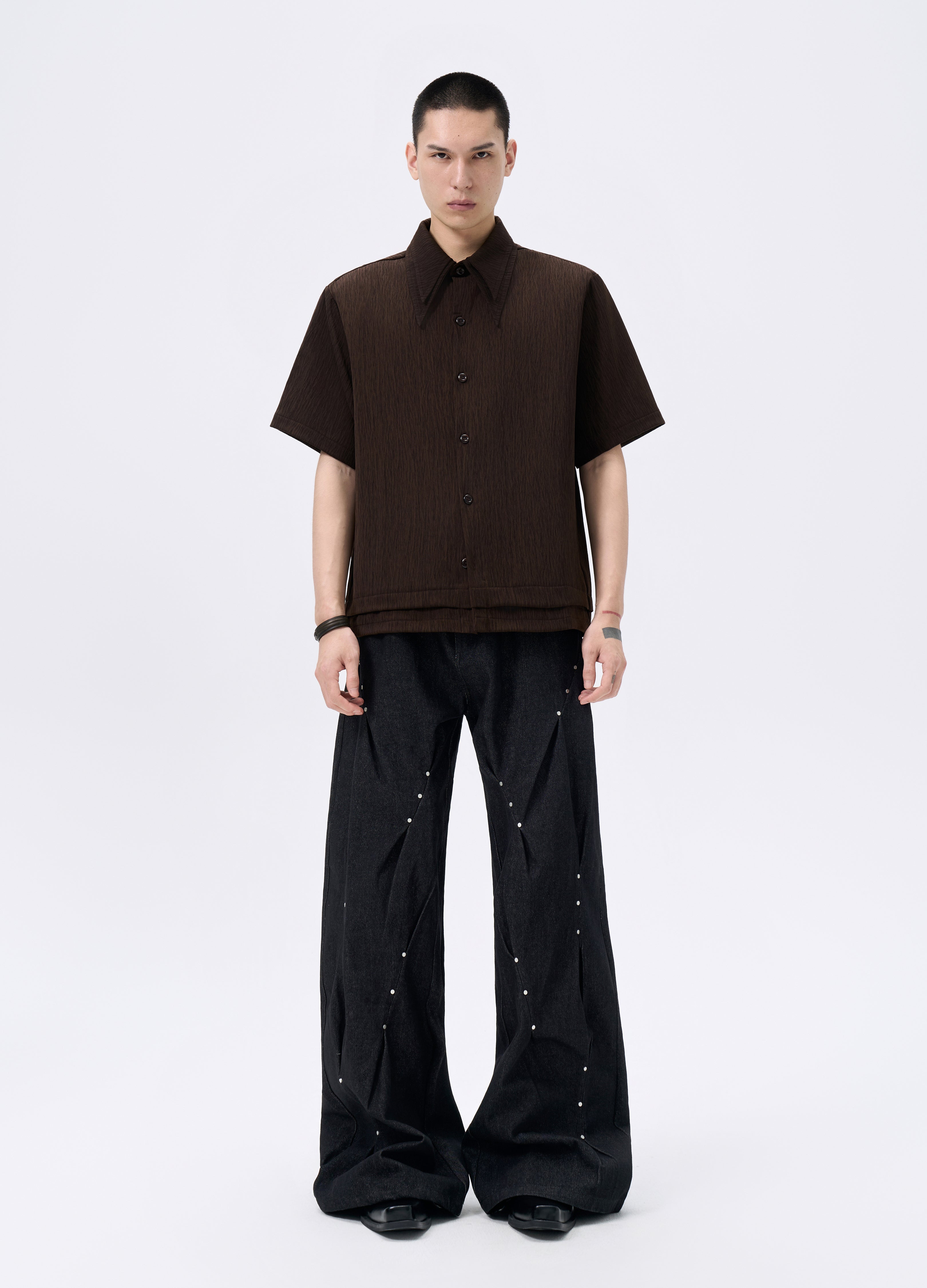 25FW STUDDED TWISTED DENIM TROUSERS