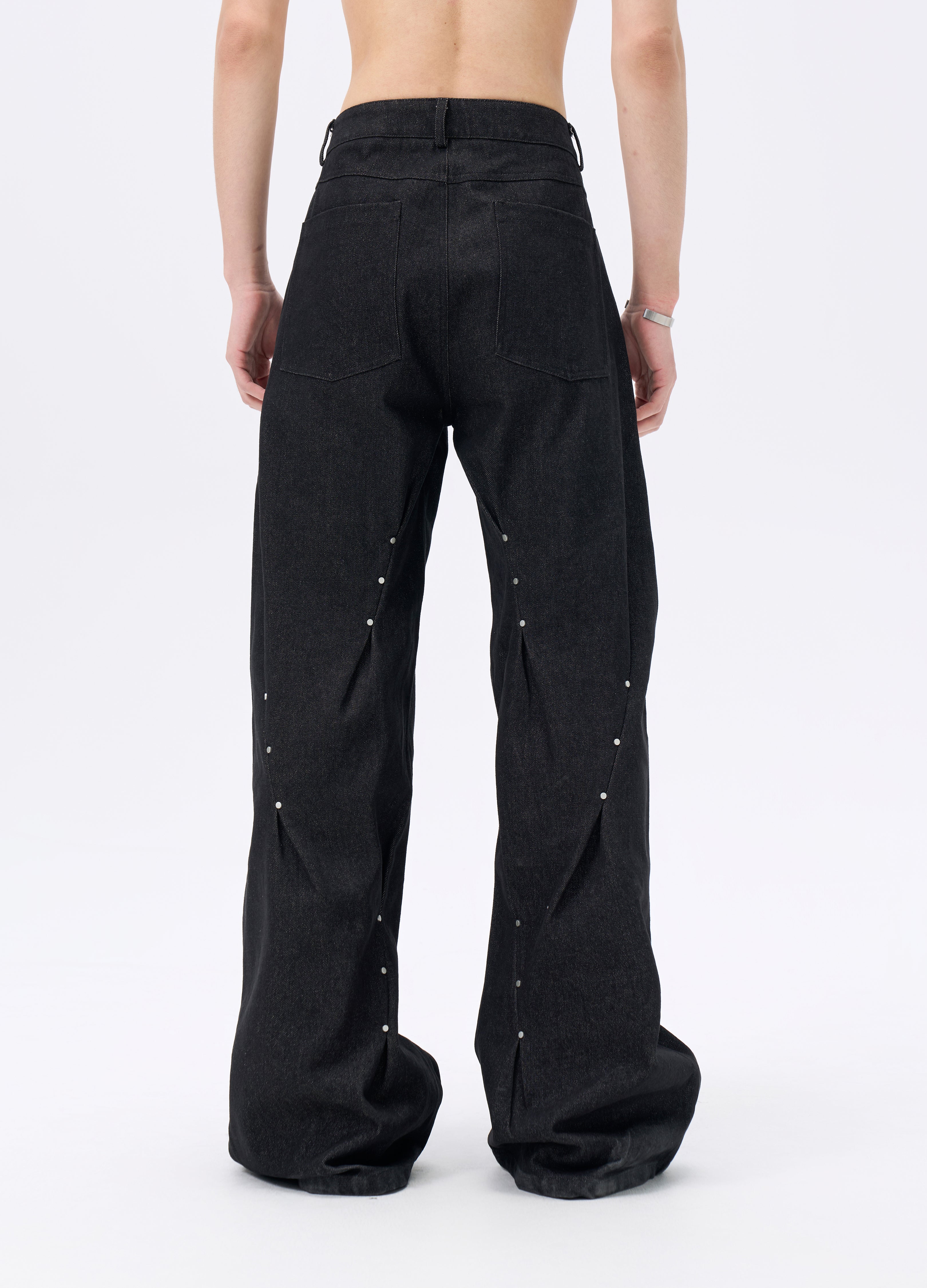 25FW STUDDED TWISTED DENIM TROUSERS