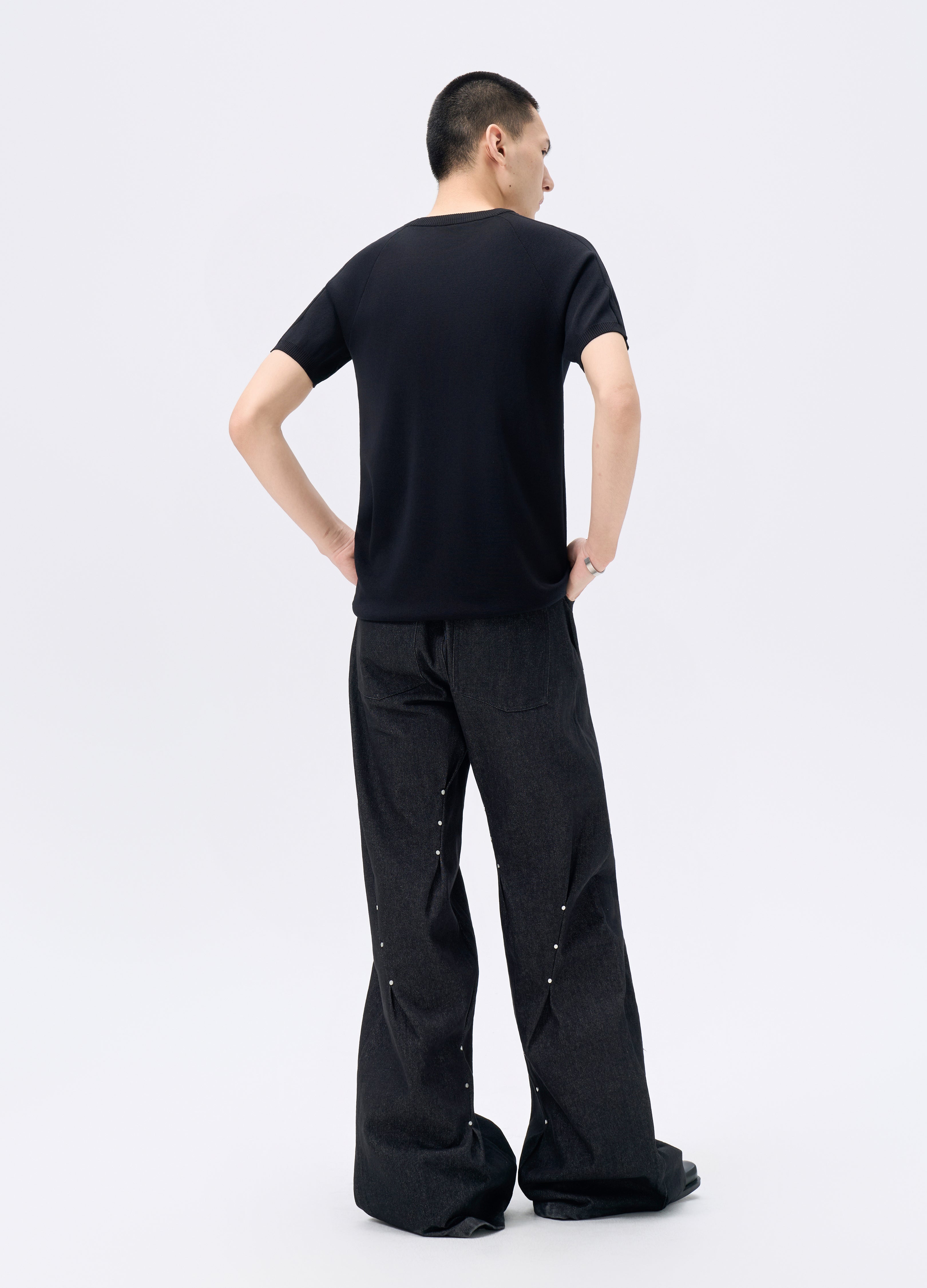 25FW STUDDED TWISTED DENIM TROUSERS